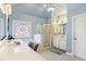 Main bathroom with large countertop, standing shower, and a frosted-glass window at 4095 Oberon Se Ct, Smyrna, GA 30080
