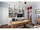 Bright office featuring built-in bookshelves, a spacious desk, and hardwood floors at 4095 Oberon Se Ct, Smyrna, GA 30080