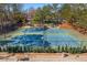 Community tennis courts with playground and covered seating area at 4095 Oberon Se Ct, Smyrna, GA 30080