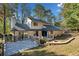 A well-maintained home features a spacious wooden deck and cozy fire pit, perfect for outdoor gatherings at 4861 Karls Gate Dr, Marietta, GA 30068