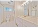 Bright bathroom featuring a window and white cabinets at 4861 Karls Gate Dr, Marietta, GA 30068