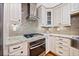 A kitchen features granite countertops, stainless steel appliances, and custom cabinetry at 4861 Karls Gate Dr, Marietta, GA 30068