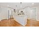 Modern kitchen featuring an island, stainless steel appliances, and hardwood flooring at 4861 Karls Gate Dr, Marietta, GA 30068