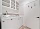 Bright laundry room with washer, dryer, and storage space at 4861 Karls Gate Dr, Marietta, GA 30068