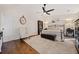 Spacious primary bedroom with a ceiling fan, a comfortable chair, and a beautiful accent rug at 4861 Karls Gate Dr, Marietta, GA 30068