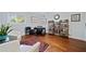 Home office area with a desk, bookshelf, and hardwood floors at 4861 Karls Gate Dr, Marietta, GA 30068