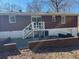 The house's backyard features a brick patio, stairs, and sliding glass door to the home at 6756 Brookwood Cir, Jonesboro, GA 30043