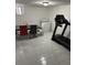 A partially-finished basement area has tile floor, dining set, treadmill and laundry hookups at 6756 Brookwood Cir, Jonesboro, GA 30043