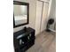 Bedroom featuring dark wood floors, a sliding-door closet, and a modern fan at 6756 Brookwood Cir, Jonesboro, GA 30043
