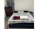 Cozy bedroom featuring a dark wood dresser and patterned linens at 6756 Brookwood Cir, Jonesboro, GA 30043