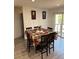 Bright dining area features a wood table, seating for six, and a sliding-door exit at 6756 Brookwood Cir, Jonesboro, GA 30043