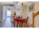 Charming dining area with wood floors, classic table set, and open view to other living spaces at 202 Accord Ln, Grayson, GA 30017