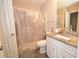 Bathroom with a granite vanity, framed mirror and a shower tub combination at 5647 Executive Way, Norcross, GA 30071