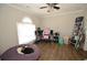 Bedroom with a large window, wood floors, and a comfortable beanbag chair at 5647 Executive Way, Norcross, GA 30071