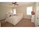 Bright bedroom featuring a large window, neutral walls, and a ceiling fan at 5647 Executive Way, Norcross, GA 30071