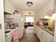 Cozy kitchen with white appliances and cabinets, and granite countertops at 5647 Executive Way, Norcross, GA 30071