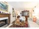 Inviting living room featuring a fireplace, hardwood floors, elegant decor, and comfortable seating at 93 Verlaine Nw Pl, Atlanta, GA 30327