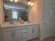 Bathroom featuring a double vanity with white cabinets and sleek hardware at 1200 Bar Harbor Pl, Lawrenceville, GA 30044