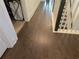 Hallway with hardwood flooring, white trim, and natural light filtering from nearby windows and doorways at 1200 Bar Harbor Pl, Lawrenceville, GA 30044