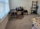 Well-lit home office space featuring a modern desk and comfortable workspace at 1200 Bar Harbor Pl, Lawrenceville, GA 30044