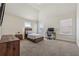 Bright bedroom with high ceilings, a bed, a desk, and ample natural light creating a relaxing atmosphere at 1263 Polk Xing, Mcdonough, GA 30252