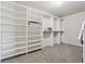 Walk-in closet featuring built-in shelving and hanging rods for maximum storage at 1263 Polk Xing, Mcdonough, GA 30252