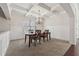 Dining room with coffered ceiling, wainscotting, and chandelier at 1263 Polk Xing, Mcdonough, GA 30252