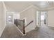 Upstairs hallway has new carpet and high ceilings, leading to several bedrooms at 1263 Polk Xing, Mcdonough, GA 30252