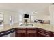 Kitchen featuring granite counters overlooking living room with fireplace at 1263 Polk Xing, Mcdonough, GA 30252