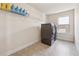 Clean laundry room features tile floor, a window, and a modern washer and dryer set at 1263 Polk Xing, Mcdonough, GA 30252