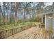 Wooden deck overlooking a wooded backyard at 105 Spring Forest Way, Sharpsburg, GA 30277