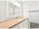 Bathroom vanity with stone countertop, white cabinets, and modern fixtures at 105 Spring Forest Way, Sharpsburg, GA 30277