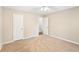 Cozy bedroom featuring neutral walls, carpet flooring, and a ceiling fan at 105 Spring Forest Way, Sharpsburg, GA 30277