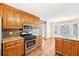 Chef's kitchen boasting stainless steel appliances, granite counters, and adjacent breakfast nook, perfect for gatherings at 105 Spring Forest Way, Sharpsburg, GA 30277