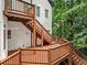 Exterior of home with stairs from the deck to the backyard at 4000 Wieuca Ne Rd, Atlanta, GA 30342
