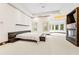 A bedroom with a fireplace, a bed, and a sitting area by the windows at 4000 Wieuca Ne Rd, Atlanta, GA 30342