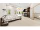 A bedroom with a fireplace, a bed, and a sitting area by the windows at 4000 Wieuca Ne Rd, Atlanta, GA 30342