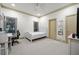 Neutral bedroom with carpet, a twin bed, an attached office, and plenty of natural light at 4000 Wieuca Ne Rd, Atlanta, GA 30342