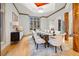 Spacious dining room with beautiful hardwood floors, seating for ten, and an adjacent serving buffet at 4000 Wieuca Ne Rd, Atlanta, GA 30342