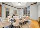 Elegant dining room featuring hardwood floors, stylish seating for eight, and ample natural light at 4000 Wieuca Ne Rd, Atlanta, GA 30342