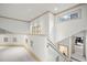 Bright upstairs hallway with natural light and a view of the surrounding landscape at 4000 Wieuca Ne Rd, Atlanta, GA 30342