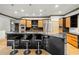 Open kitchen with bar seating, granite countertops, stainless steel appliances and pendant lighting at 4000 Wieuca Ne Rd, Atlanta, GA 30342