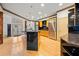 Kitchen featuring an island with seating, granite counters, stainless appliances, and hardwood floors at 4000 Wieuca Ne Rd, Atlanta, GA 30342