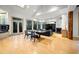 Bright and open living space with hardwood floors, large windows, and a cozy fireplace area at 4000 Wieuca Ne Rd, Atlanta, GA 30342