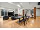 Spacious living area with hardwood floors, a modern fireplace, and an open dining area for entertaining at 4000 Wieuca Ne Rd, Atlanta, GA 30342