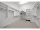 Well-organized walk-in closet with built-in shelving and ample storage space for clothing and accessories at 4000 Wieuca Ne Rd, Atlanta, GA 30342