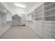 Bright walk-in closet featuring extensive shelving and drawer systems, providing organized and accessible storage solutions at 4000 Wieuca Ne Rd, Atlanta, GA 30342