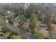 Aerial shot of the property shows its surrounding area, neighborhood, and well-kept landscaping at 4000 Wieuca Rd Ne, Atlanta, GA 30342