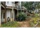View of the exterior backyard features a deck, yard waste, and backyard landscaping at 4000 Wieuca Rd Ne, Atlanta, GA 30342