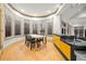 A sun-filled breakfast nook features hardwood floors, large windows, and a counter bar at 4000 Wieuca Rd Ne, Atlanta, GA 30342